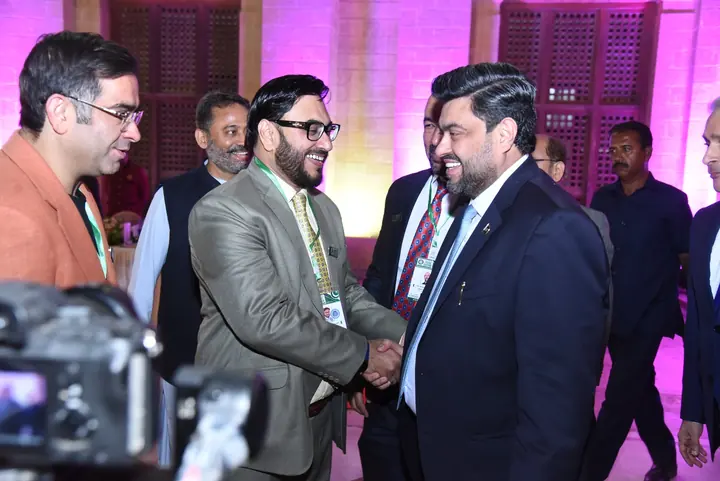 PAC leaders and guests exchanging greetings during the ceremony.